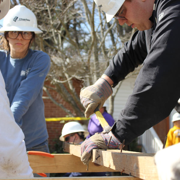 Volunteers building a home for Habitat for Humanity.
